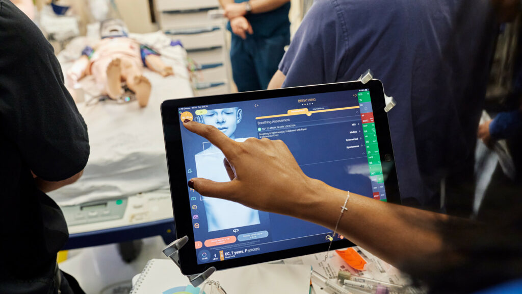 T6 health systems iPad being used in a simulated hospital environment